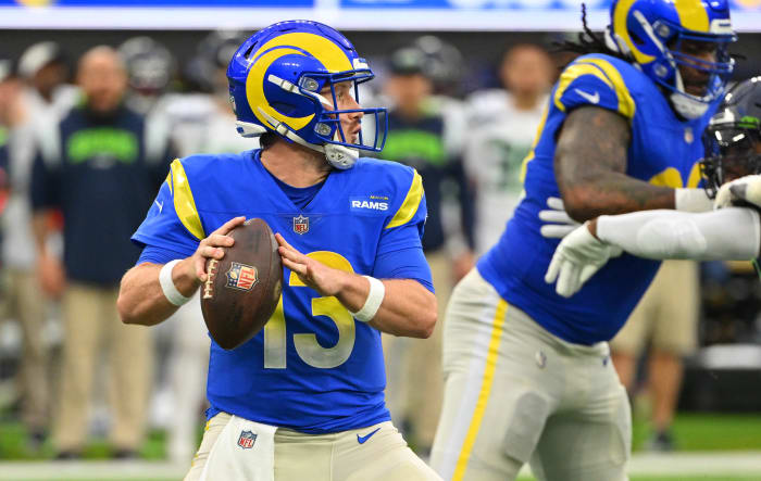 Dec 4, 2022; Inglewood, California, USA; Los Angeles Rams quarterback John Wolford (13) sets to pass in the first half against the Seattle Seahawks at SoFi Stadium.